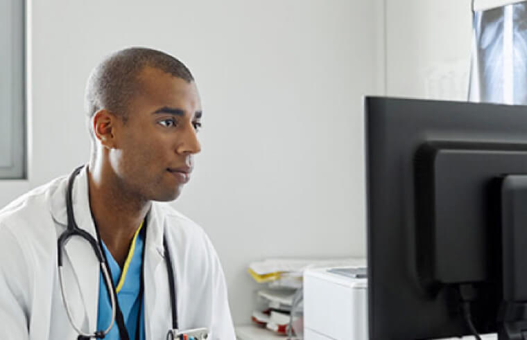 Healthcare professional intently watching something